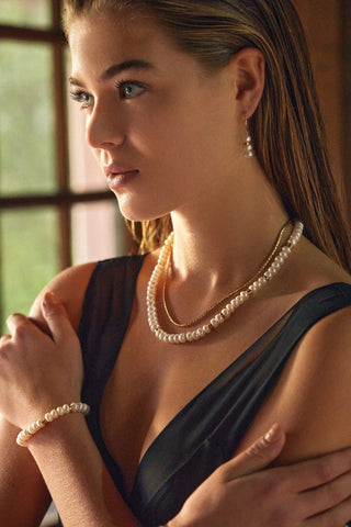 Lifestyle — Aline Pearls Bracelet stacked with gold and pearl jewelry