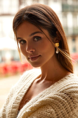 Model wearing Baroque Earrings — bold, timeless elegance