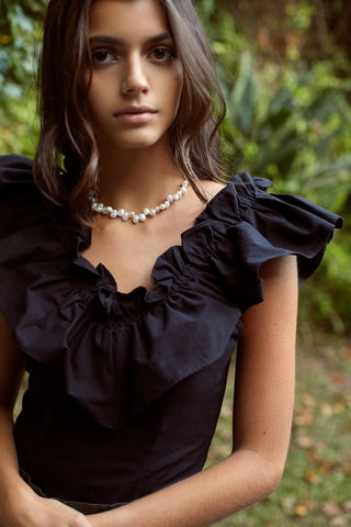 Model wearing Celeste Pearls Necklace — refined minimalist style