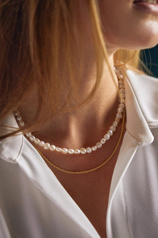 Close-up of pearls and 24K gold-plated extension chain