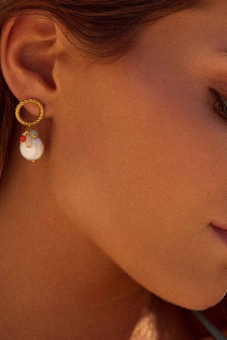 Close-up of Nikki Pearls Earrings showing pearls and golden hooks