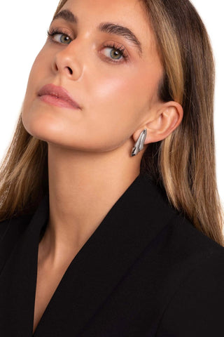 Lifestyle photo of Sculpted Earrings with minimal outfit